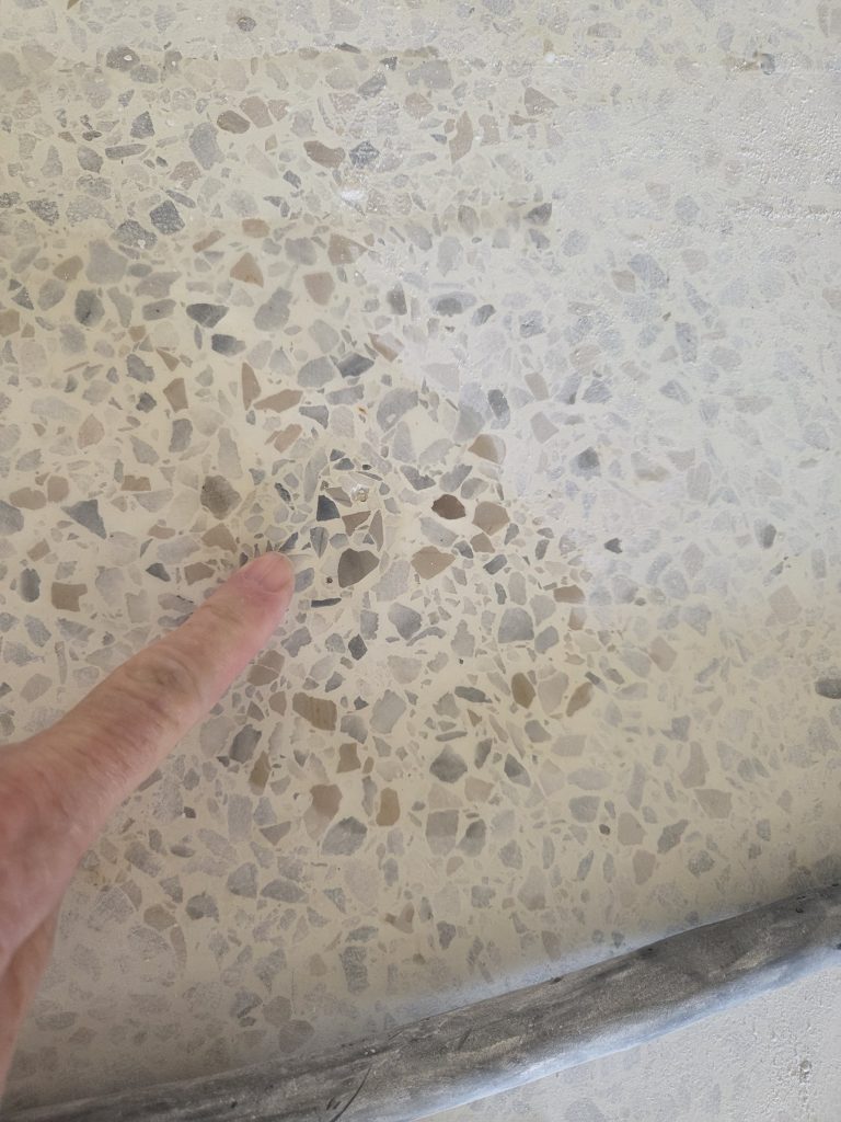 Color-matched terrazzo floor repair using matching marble aggregate by E&C Floor Care & Restoration